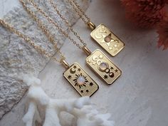 We're so excited to introduce my new line of high quality, anti-tarnish, waterproof jewelry. Thanks to our special plating technique, this celestial beauty is built to last, both pendant and chain are anti tarnish and waterproof. Crafted with hypoallergenic 18k gold stainless steel, it's lead and nickel free and safe and comfortable for sensitive skin. Your choice of pendants feature three of my favorite Major Arcana cards and a sweet little faux opal cabochon for an added touch of mystery. Choo Celestial Moon Phase Charm Necklace For Gift, Celestial Stainless Steel Necklaces As Gift, Celestial Stainless Steel Necklace For Gifting, Celestial Stainless Steel Necklace As Gift, Celestial Stainless Steel Necklace For Gift, Celestial Style Stainless Steel Necklace For Gift, Celestial Stainless Steel Jewelry For Gifts, Celestial Pendant Charm Necklace With Adjustable Chain, Silver Celestial Necklace Tarnish Resistant