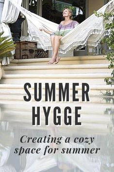 a woman sitting in a hammock on the steps with text reading summer hygge creating a cozy space for summer