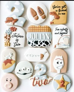 decorated cookies are displayed on a white surface