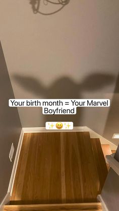 a room with a wooden floor and a light fixture above it that says, your birth month = your marvel boyfriend