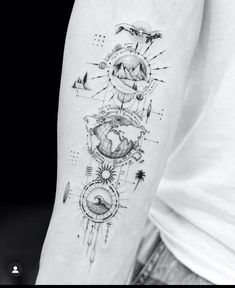 a person with a tattoo on their arm that has an image of the earth and sun