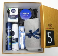 an open box containing several items for men's grooms to use in the bathroom