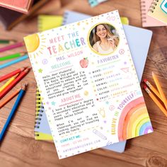 a teacher's welcome card with pencils next to it on a wooden table