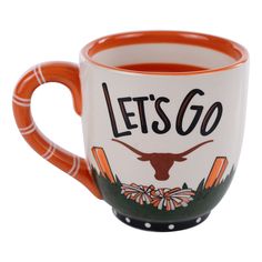 an orange and white coffee mug with the words let's go on it