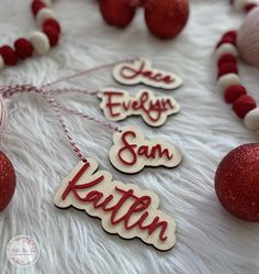 some red and white ornaments are laying on the fur