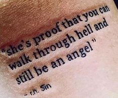 a tattoo saying she's proof that you can walk through hell and still be an angel