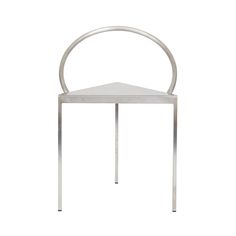 a metal chair with a curved back and seat on the bottom, against a white background