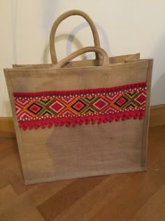 a brown bag sitting on top of a wooden floor