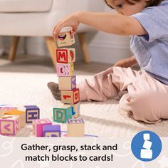 a young child playing with blocks on the floor