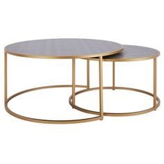 two round tables with metal bases on each side, one in gold and the other in grey