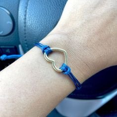 The Navy blue cord bracelet, made of waxed cord, is perfect for your jean outfit. This bracelet represents a fantastic gift for the family. This cord bracelet was designed for everyday wear. This heart charm bracelet enhances your casual outfit. ♥ ITEM DETAILS: Total length: The size of the bracelet is adjustable. Materials: Gold plated heart charm - Waxed cord bracelets Charm color available: Gold. Waxed Cord Available: Navy Blue. Waxed Cord Size: 1.5mm waxed cord. ♥ GIFT IT Jewelry comes in a Adjustable Blue Bracelet With Heart Charm, Blue Adjustable Heart Bracelet For Gift, Heart-shaped Adjustable Friendship Bracelets, Everyday Heart-shaped Friendship Bracelets With Adjustable Cord, Adjustable Blue Heart Bracelet For Friendship, Casual Blue Heart-shaped Bracelets, Casual Blue Heart-shaped Bracelet, Casual Heart Charm Bracelet For Everyday Wear, Casual Adjustable Heart Charm Bracelet