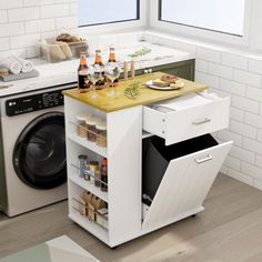 a kitchen with a washer and dryer in it