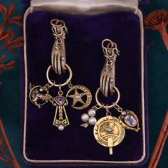 This elegant amethyst and pearl charm was originally an antique stick pin (circa 1900-1910). It is 14k gold and measures 1 inch from the top of the jump ring bail to the bottom of the charm by 0.4 inches wide. The piece is in very good condition. Materials: 14k gold, amethyst, pearl. Symbolic Brass Jewelry With Vintage Charm, Victorian Yellow Gold Dangle Jewelry, Elegant Bronze Jewelry With Charms, Antique Jewelry With Dangling Charms For Collectors, Antique Gold Victorian Dangle Jewelry, Antique Jewelry With Vintage Charm Dangle, Victorian Gold Jewelry With Charms, Antique 14k Gold Brooch Jewelry, Antique Gold Jewelry With Dangling Charms