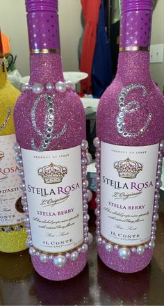 two bottles of stella roa sit on a table