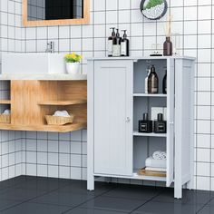 a bathroom with a sink, cabinet and mirror