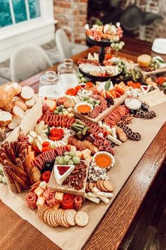 Charcuterie Graze Table for events or parties. Butcher paper ideas Paper Charcuterie Board, Butcher Paper Charcuterie Board, Charcuterie Tables, Elegant Charcuterie, Graze Table, Wedding Charcuterie, Graze Board, 1st Birthday Foods, Professional Gift Ideas