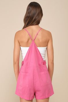 Let the good times roll all season long in the Lulus Easygoing Beauty Hot Pink Short Overall Romper! Lightweight woven fabric shapes this romper-meets-overalls hybrid that has a classic bib-front with a pocket and adjustable spaghetti straps that create a racerback-style design. A seamed waist tops relaxed shorts with front patch pockets, back pockets, and adjustable button side closures. Pair with your favorite tank top and sandals for the comfiest summer OOTD! Fit: This garment fits true to si Pink Romper Outfit, Summer Romper Outfit, Overall Romper, Pink Clothes, Hot Pink Shorts, Nashville Outfits, Summer Ootd, Let The Good Times Roll, Pink Rompers