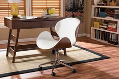 an office chair sitting on top of a hard wood floor next to a wooden desk