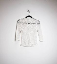 "a vintage white crochet knit blouse with cropped sleeves ✿ IMPORTANT INFORMATION: * excellent vintage condition * size: extra-small - please check exact measurements below (they're there for your benefit!) ✿ MEASUREMENTS (taken while item is lying flat, some measurements will need to be doubled): * shoulder to shoulder: 15\" (38cm) * armpit to armpit: 16\" (41cm) * length (centre of back neckline to bottom): 20\" (51cm) * sleeves (shoulder to cuff): 17\" (43cm) ✿ free UK shipping on orders over Floral Crochet Top, White Crochet Tank Top, White Crochet Blouse, White Crochet Crop Top, Crochet Floral Top, Crochet Knit Top, Check Mini Skirt, Polka Dot Midi Skirt, White Knit Top