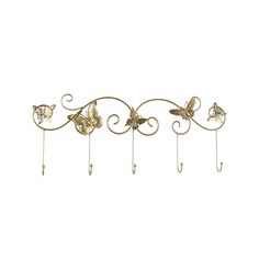 three metal hooks with butterflies hanging from them