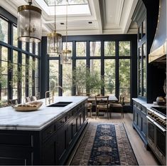 a kitchen with blue cabinets and an area rug