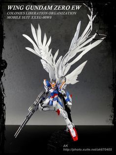 an action figure is shown with wings on its back and arms, as well as the words wing gunam zero ew