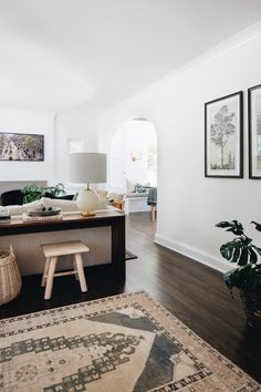 the living room is clean and ready to be used as a den or home office