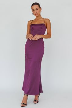 Plum maxi dress Half lined Adjustable straps Lace-up back Zipper in side Steal the show in our stunning Teneal maxi dress. We are loving the lace-up back feature! Perfect for a special event or a birthday celebration. Team it with diamante mules and a clutch for an unforgettable look. MODEL INFO Model is wearing size XS Height: 5'6" Bust: 31.5" Waist: 24.5" Hips: 34.5" CARE Hand Wash Cold. Do Not Iron. MATERIAL SPANDEX/POLYESTER Plum Gown, Purple Bridesmaid Dress, Selfie Leslie, Purple Bridesmaids, Garden Dress, Blue Bridesmaids, Iron Material, Date Night Dresses, Dress Satin