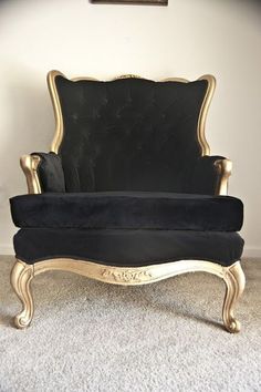 a black and gold chair sitting on top of a carpeted floor