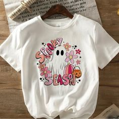 Women’s Casual Short Sleeve Halloween Shirt. Cute Retro 70s Look “Spooky Season” Gift: Cute Acrylic Ghost With Pumpkin Dangle Earrings Ghost Shirts, Fall Halloween Decorations, Ghost With Pumpkin, Groovy Halloween, Casual Halloween, 70s Look, Halloween Graphic Tees, Halloween Tees, Retro 70s