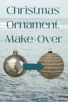 an ornament hanging from the side of a christmas tree next to the ocean