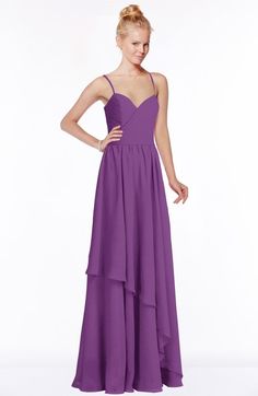 a woman in a long purple dress