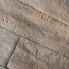 an old wooden floor with peeling paint on the top and bottom part of it's surface