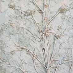 an abstract painting with white flowers and branches