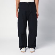 Black cotton wide trousers from Studio Nicholson featuring an elasticated waistband, a front button fastening, two side welt pockets, a back patch pocket with flap and a drawstring at the leg bottom. High-waisted Cotton Parachute Pants With Patch Pockets, Cotton High-waisted Parachute Pants With Patch Pockets, High-waisted Cotton Chinos With Patch Pockets, High-waisted Cotton Work Pants With Patch Pockets, Cotton Chinos For Streetwear, Cotton High-waisted Work Pants With Patch Pockets, Urban Cotton Parachute Pants For Work, Cotton Wide-leg Work Pants With Welt Pockets, Black Cotton Chinos With Pockets