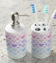 two toothbrush holders are sitting next to each other