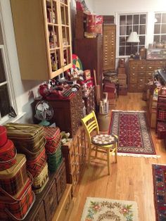 a room filled with lots of different types of furniture and rugs on the floor