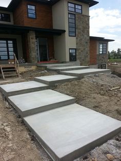 concrete steps leading up to a house under construction