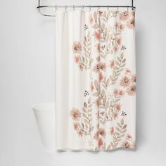 a shower curtain with pink flowers on it