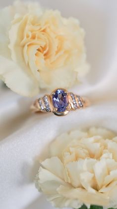 * Ring Material: Tanzanite, Diamond, 14K Yellow Gold * Ring Dimensions: 9x15MM Top Design, 2.9MM Tapering Band * Size: 6.5 * Stone Weight & sizes: Tanzanite - 0.86ct, Diamond - 0.25ct * Overall weight: 4.2g Classic Formal Birthstone Ring With Gemstone Accents, Tanzanite Yellow Gold Rings With Diamond Accents, Yellow Gold Tanzanite Rings With Diamond Accents, Timeless Tanzanite Rings For Anniversary, Classic Rings With Gemstone Accents For Anniversary, Classic Sapphire Rings With Gemstone Accents, Classic Anniversary Rings With Gemstone Accents, Elegant Oval Tanzanite Birthstone Ring, Classic Diamond Ring With Gemstone Accents