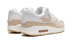 The Women’s Air Max 1 "Sanddrift" is a women’s-exclusive colorway of the retro running shoe with a versatile, summer-ready look.  The “Sanddrift” Air Max 1 features a white mesh base with tonal leather overlays on the forefoot and mid-panel.  A Sanddrift leather Swoosh matches the color of the leather mudguard.  A debossed “Nike Air” logo can be found on the heel and a debossed “Nike” detail lands on the tongue tag.  Underfoot, a clear Air bubble in the heel of the midsole completes the look.  R Air Max 1 Women, Air Logo, Retro Running Shoes, Exclusive Sneakers, White And Beige, Nike Dunk High, Nike Air Max 1, Nike Shox, Air Jordan 3