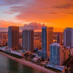 an aerial view of the beach and buildings in miami, florida at sunset or sunrise