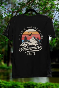 🌲✨ Embrace your love for the great outdoors with our "Adventure Awaits: The Mountains Are Calling" T-shirt! This nature-inspired design beautifully showcases majestic mountains and vibrant trees 🌳, inviting you to explore the breathtaking beauty of the wilderness. Perfect for hiking enthusiasts, campers, or anyone who finds peace among the pines, this shirt is a reminder to chase your adventures. Crafted from soft, breathable fabric, it's ideal for those long days on the trail or casual outings with friends. Wear it as a badge of honor and let the world know that nature is calling--are you ready to answer? 🌄💚 Outdoor Crew Neck T-shirt With Letter Print, Crew Neck T-shirt With Letter Print For Hiking, Outdoor Graphic Tee With Logo Print, Graphic Tee With Logo Print For Outdoor, Black Crew Neck T-shirt For Camping, Black Hiking T-shirt With Letter Print, Black T-shirt For Hiking With Letter Print, Logo Print T-shirt For Outdoor Activities, Short Sleeve T-shirt With Logo For Outdoor Activities