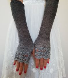 SILVER SHADOWS Elegant extra long fingerless gloves are gently knitted and crochet in luxurious light weight wool/acrylic yarn. Crochet edges and color shades make them bohemian, elegant and chic, and they are long enough and warm to be practical and wearable... Colors ranging in the pastel shades of silver gray and charcoal. It fits most women sizes. Length (unstretched) : 17 inches / 43 cm Width (unstretched) : 3 1/2 inches / 9 cm Winter Fitted Knitting Pattern In Yarn, Gothic Gloves, Crochet Edges, Long Fingerless Gloves, Winter Mittens, Fingerless Gloves Knitted, Wrist Warmers, Long Knit, Pastel Shades