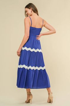 A solid woven midi dress featuring straight neckline, straps, tiered skirt with lace on top and back zipper closure Details: Self : 38% Rayon 24% Nylon 38% PolyesterLining : 100% Polyester Size & Fit - Model is 5`9" And Wearing Size Small- Measurements Taken From Size Small- Approx. Length: 45" Blue Tiered Midi Dress For Day Out, Blue Midi Dress With Ruffles And Spaghetti Straps, Blue Midi Dress With Spaghetti Straps And Ruffles, Blue Tiered Summer Midi Dress, Spring Blue Tiered Dress With Ruffled Straps, Blue Midi Dress With Adjustable Straps For Day Out, Blue Midi Tiered Dress For Beach, Blue Midi Dress With Adjustable Straps, Blue Midi-length Tiered Dress For Beach