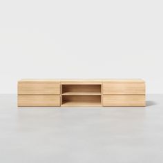 the sideboard is made out of wood and has two open shelves on one side