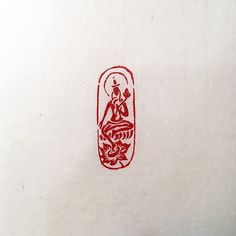 a red and white drawing of a person sitting on a bench