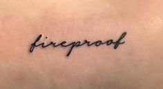 the word fireproof written in cursive writing on a woman's back