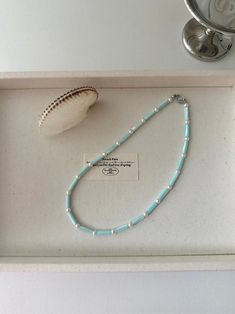 Ocean Beaded Pearl Necklace | Jewelry | Three Fleas Turquoise Pearl Beaded Necklaces As Gift, Turquoise Pearl Beaded Necklace Gift, Turquoise Pearl Beaded Necklace For Gift, Handmade Turquoise Pearl Necklace, Handmade Pearl White Beads For Gifts, Pearl Beaded Necklaces For Jewelry Making, Bohemian Pearl Beaded Necklaces For Gift, Turquoise Pearl Necklace Gift, Polished Pearl Beads For Jewelry Making