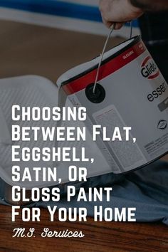 a person holding a paint can with the words choosing between flat, eggshell, satin or gloss paint for your home